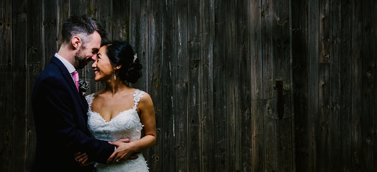 A bride and groom share a moment away from their family and friends