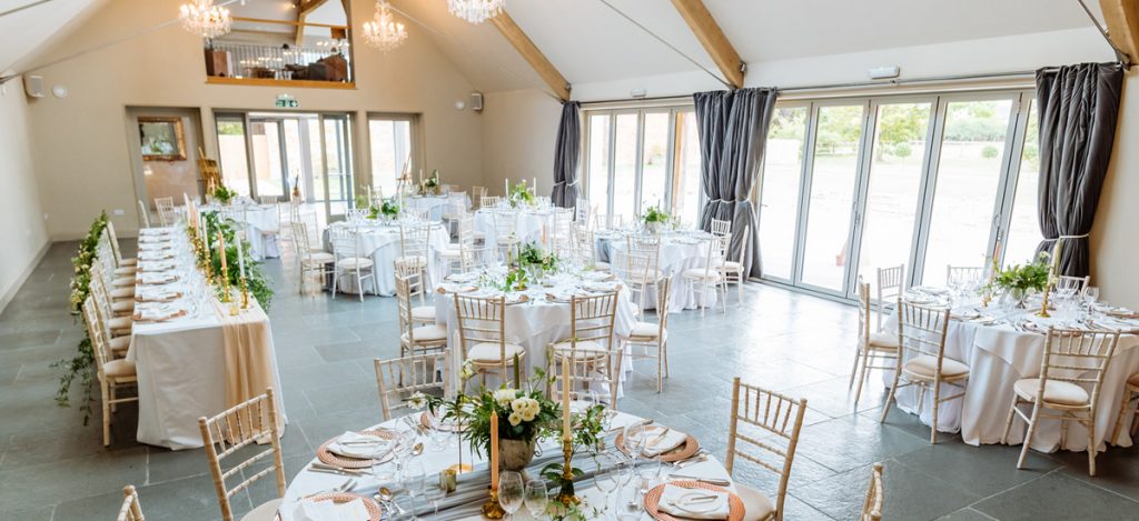 Guests enjoy a delicious wedding breakfast in the Orchard Barn expertly prepared by our expert on-site catering team